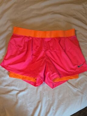 Nike Women’s Pink Athletic Shorts with Orange Waistband
